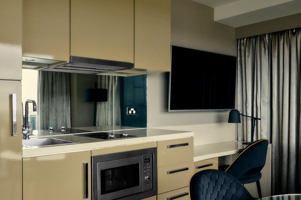 The Kinson Melbourne Exterior foto A kitchen in a serviced apartment